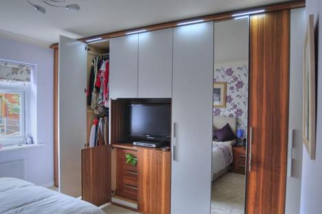 Fitted Bedrooms with built in TV and mirror doors.