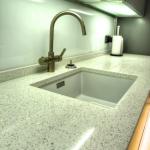 Large Blanco silgranit sink fitted under the Cliveden Aspro quartz worktop with machined drainer grooves.