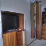 Fitted wardrobes in white and walnut with full length mirror