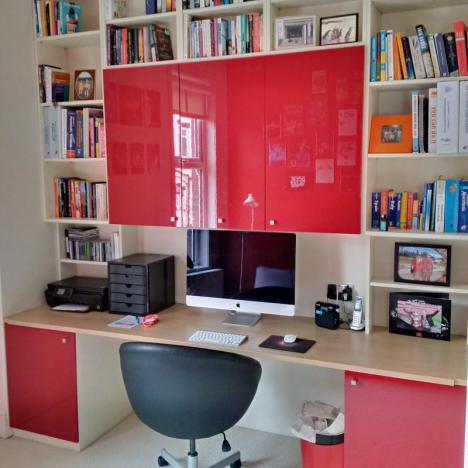 Home office bookshelves and cupboards with red gloss doors and wood finish desk