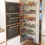 Fully stocked tall kitchen larder unit and oven housing with raised double oven and microwave