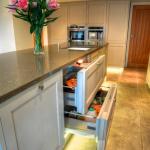 refrigerator drawers in centre island alleviates the need for tall unit