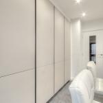 white high gloss handleless Keller kitchen tall housings with vertical trim