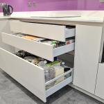 Kitchen drawers open to reveal generous storage 