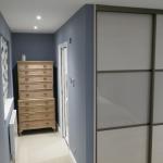 Wardrobe with sliding doors and entrance to ensuite wet room